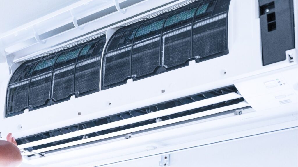 Technician repairing an air-conditioner system